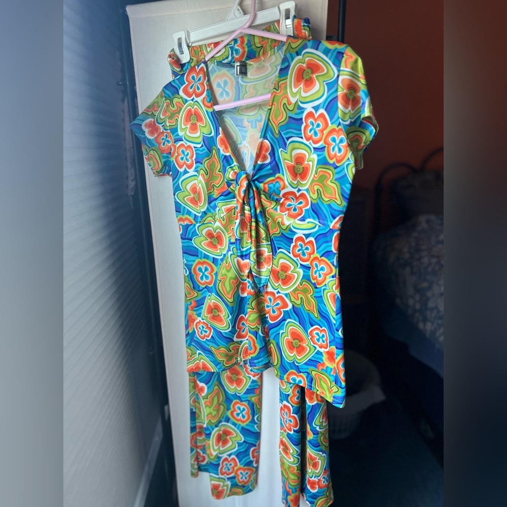 Two piece 70’s inspired polyester shirt and pant.